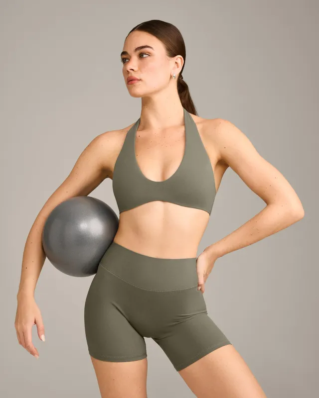 SoftMotion™ Minimal Halter Neck Bralette with Grey Logo | Alpine Green made by Oner Active