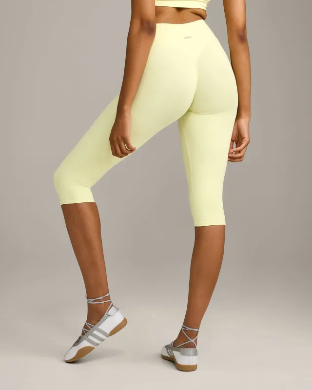 SoftMotion™ High Waisted Capri Leggings with Grey Logo | Pastel Yellow made by Oner Active