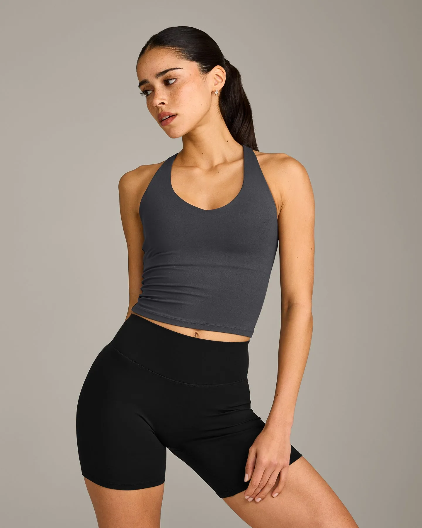 SoftMotion™ Racer Back Mid Vest with Built in Bra Shelf with Grey Logo | Coal sold by Oner Active