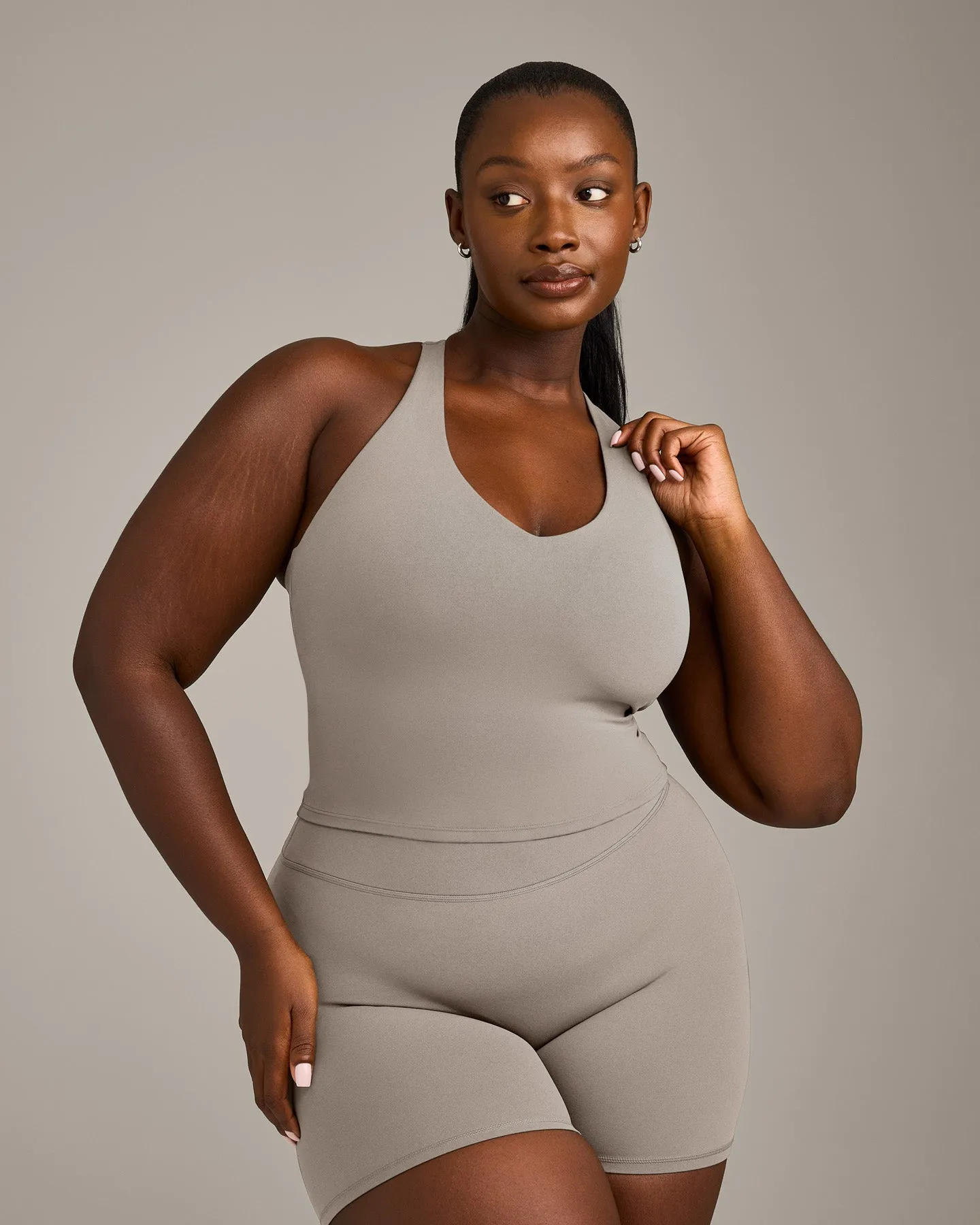 SoftMotion™ Racer Back Mid Vest with Built in Bra Shelf with White Logo | Warm Sand sold by Oner Active