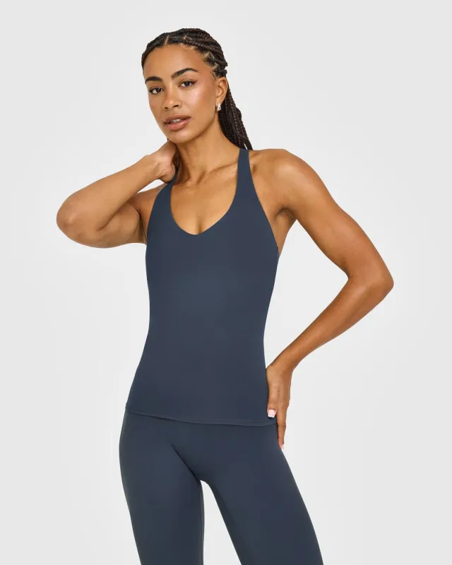 SoftMotion™ Racer Back Vest with Built in Bra Shelf with White Logo | True Blue made by Oner Active