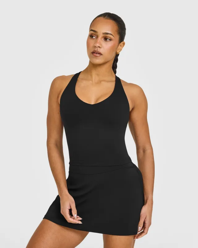 SoftMotion™ Racer Back Mid Vest with Built in Bra Shelf with White Logo | Black made by Oner Active