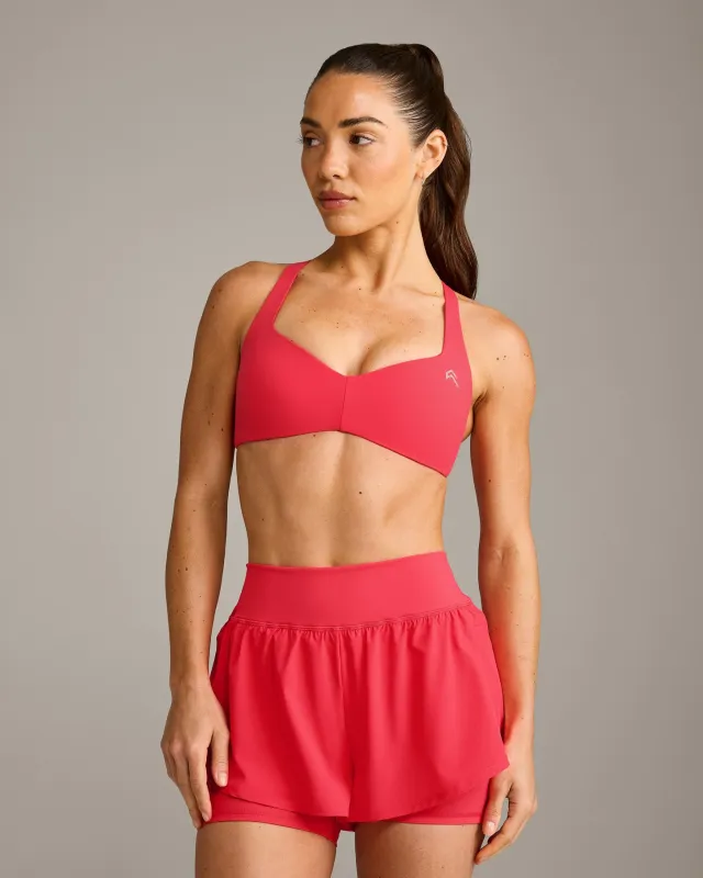 UnifiedMove™ T Back Minimal Bralette with Reflective Logo | Charged Pink made by Oner Active