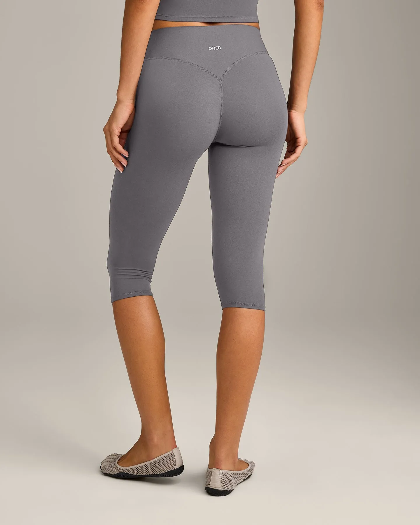 SoftMotion™ High Waisted Capri Leggings with Grey Logo | Ash Grey sold by Oner Active