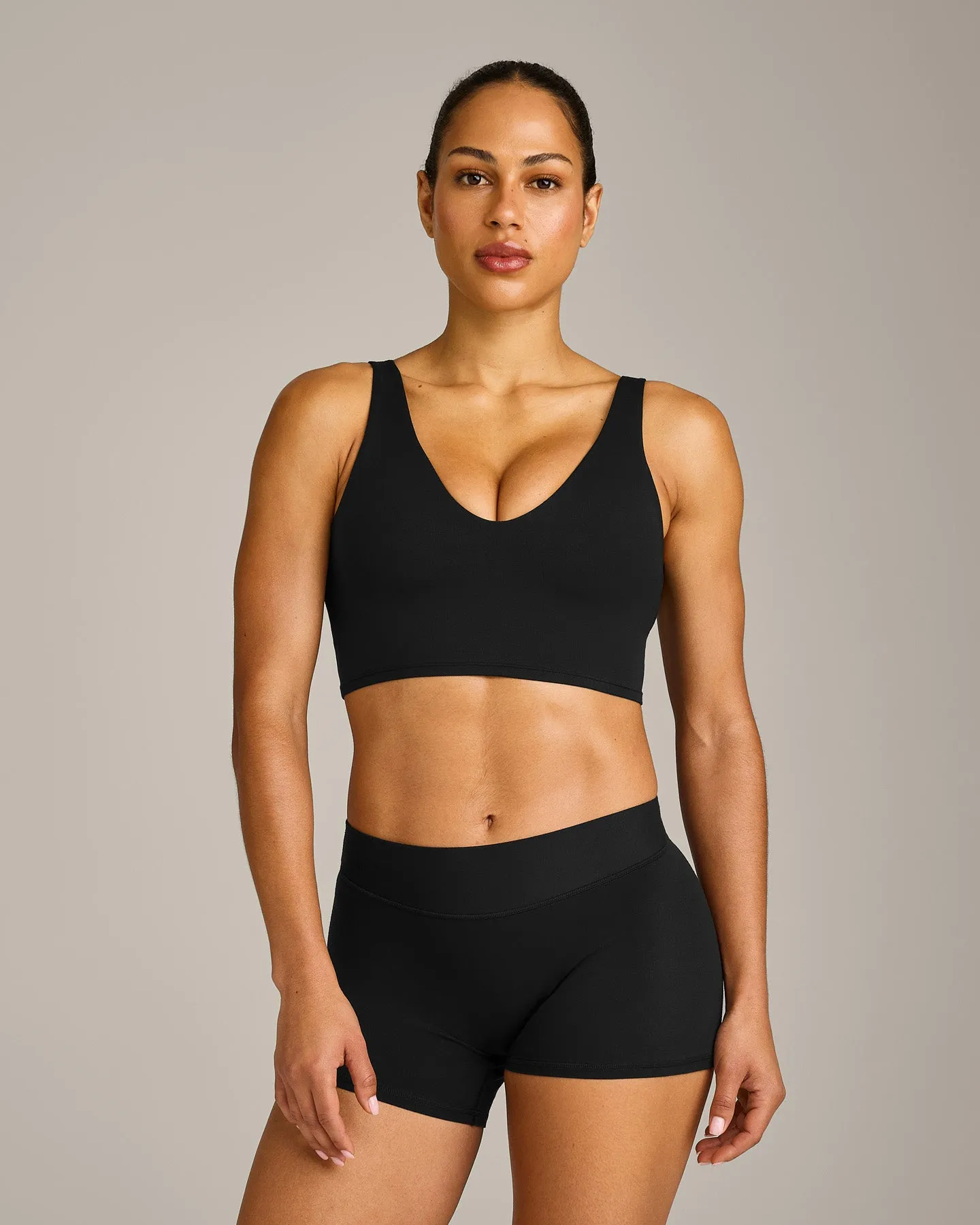 SoftMotion™ Longline Sports Bra with Grey Logo | Black sold by Oner Active