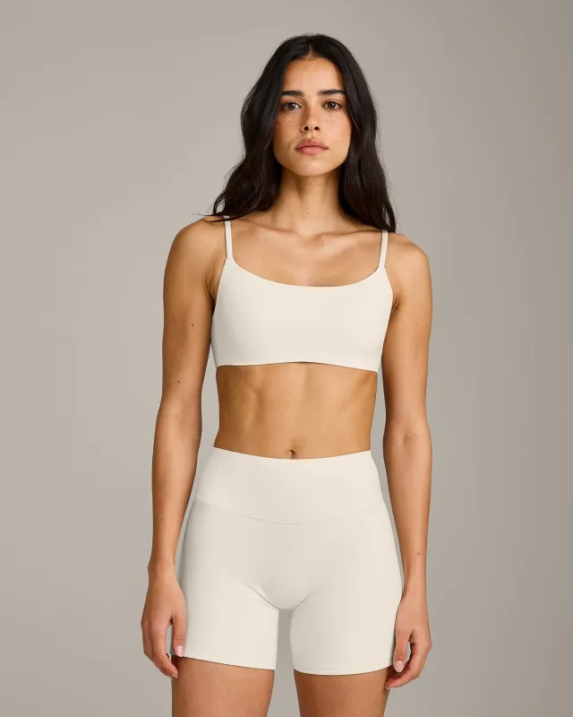 SoftMotion™ Strappy Sports Bra with Gray Logo | Marshmallow White made by Oner Active