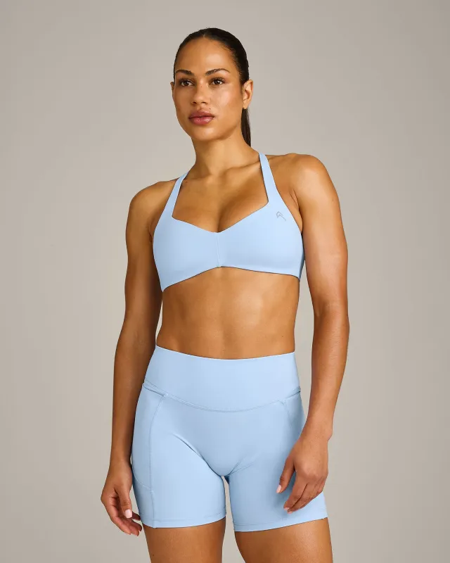 UnifiedMove™ T Back Minimal Bralette with Reflective Logo | Powdered Blue made by Oner Active