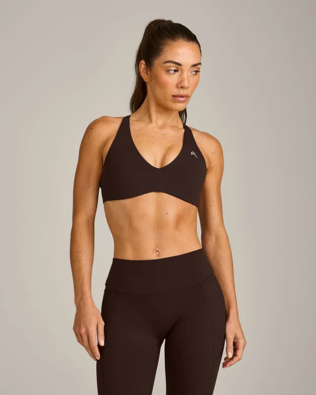 UnifiedMove™ Cross Back Sports Bra with Reflective Logo | 70% Cocoa made by Oner Active