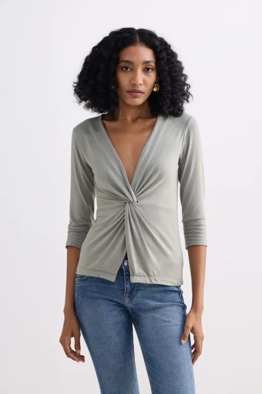 Twist Front Knit Shirt in Light Olive sold by Reistor