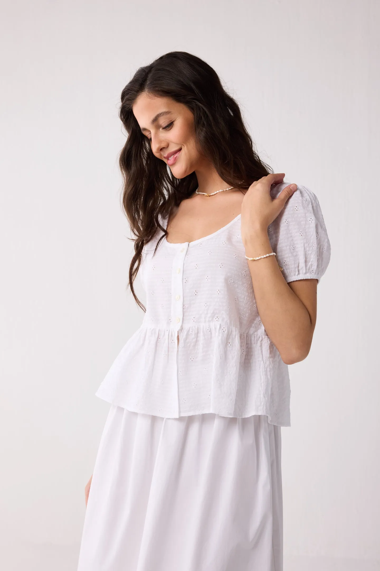 Embroidered Peplum Top with Puff Sleeves in White sold by Reistor product image thumbnail 3