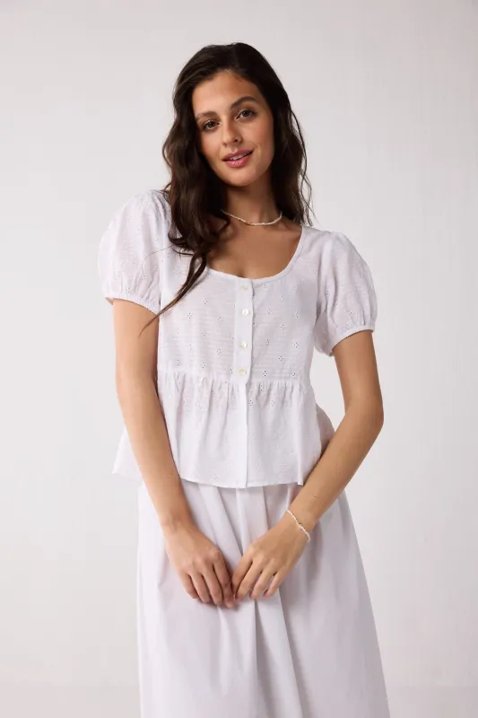 Embroidered Peplum Top with Puff Sleeves in White sold by Reistor