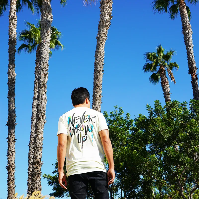 Never Grow Up Midweight Tee sold by Merchlabs