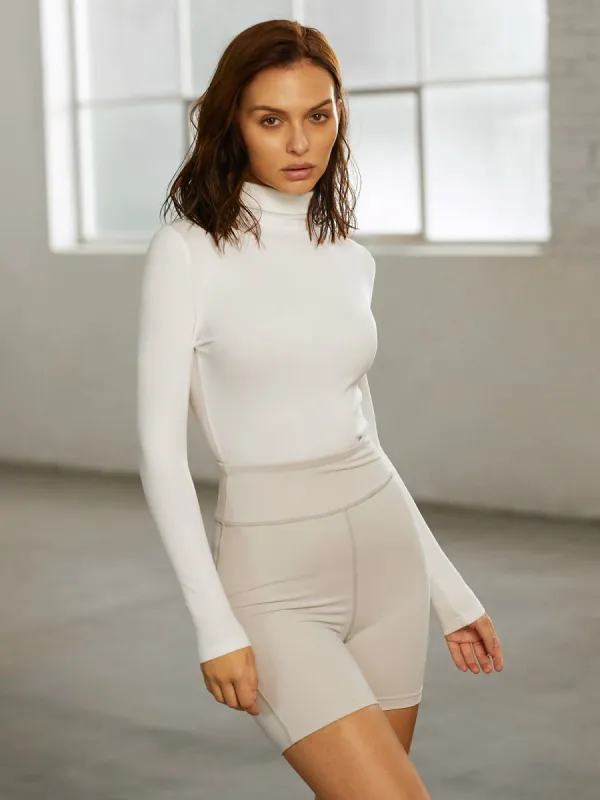 Solid Colored Performance Long Sleeve Mock Neck Top sold by COMMENSE