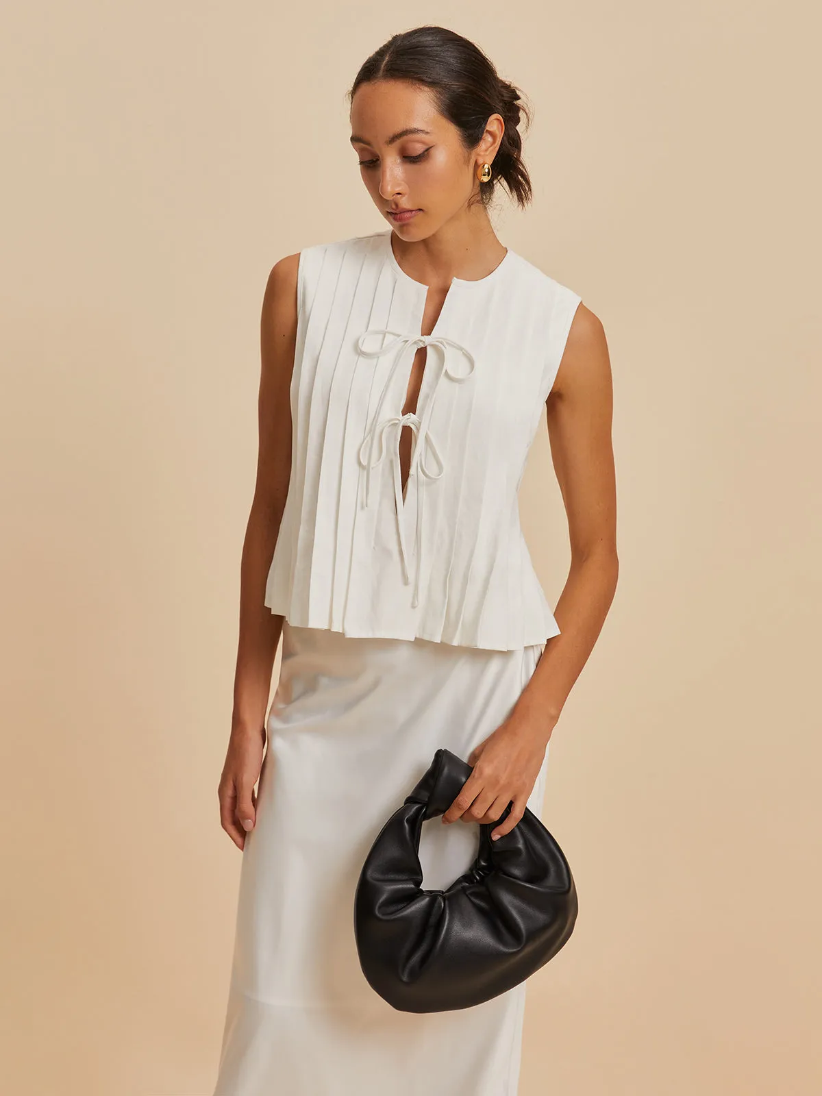 Pleated Knotted Sleeveless Blouse sold by COMMENSE