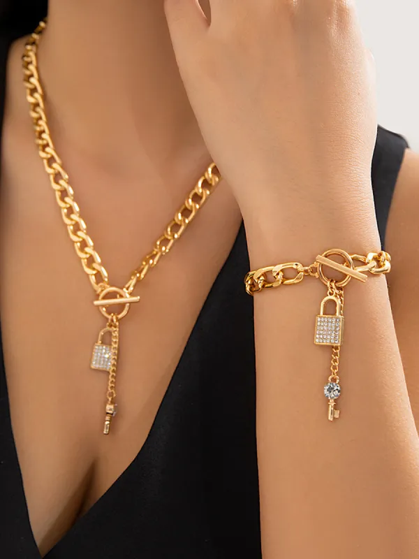 Rhinestone Encrusted Key Lock Necklace With Chain Bracelet sold by COMMENSE