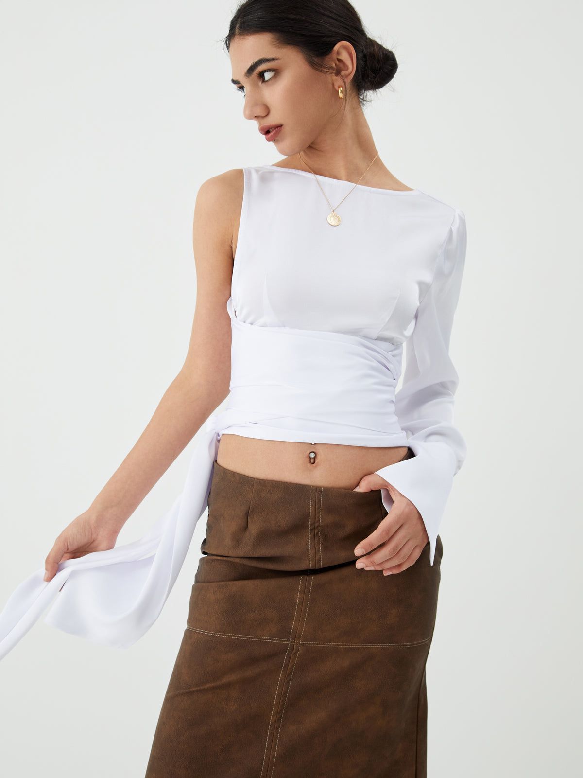Solid Asymmetric Backless Top sold by COMMENSE