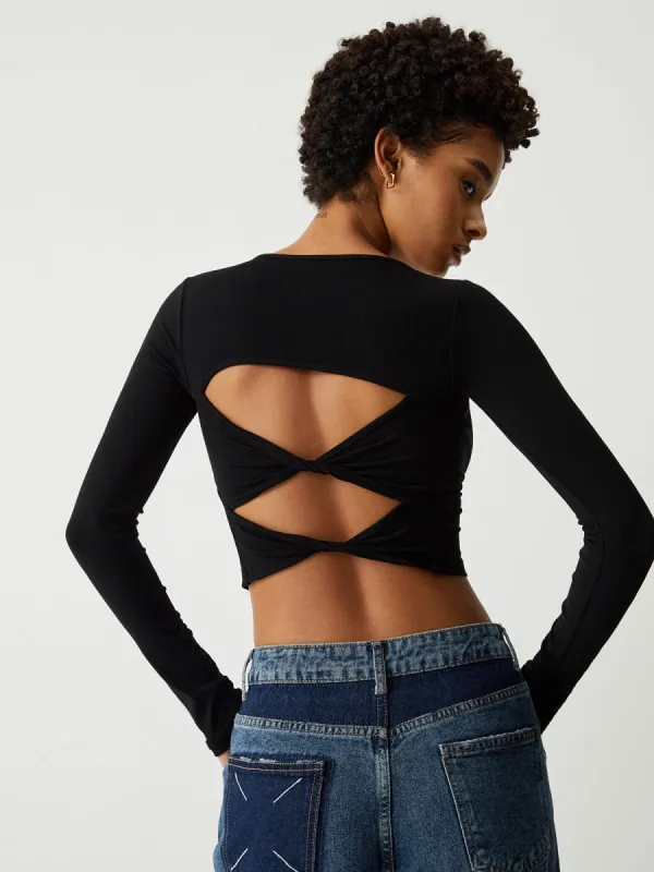Back Twist Cutout Long Sleeve Crop Top made by COMMENSE