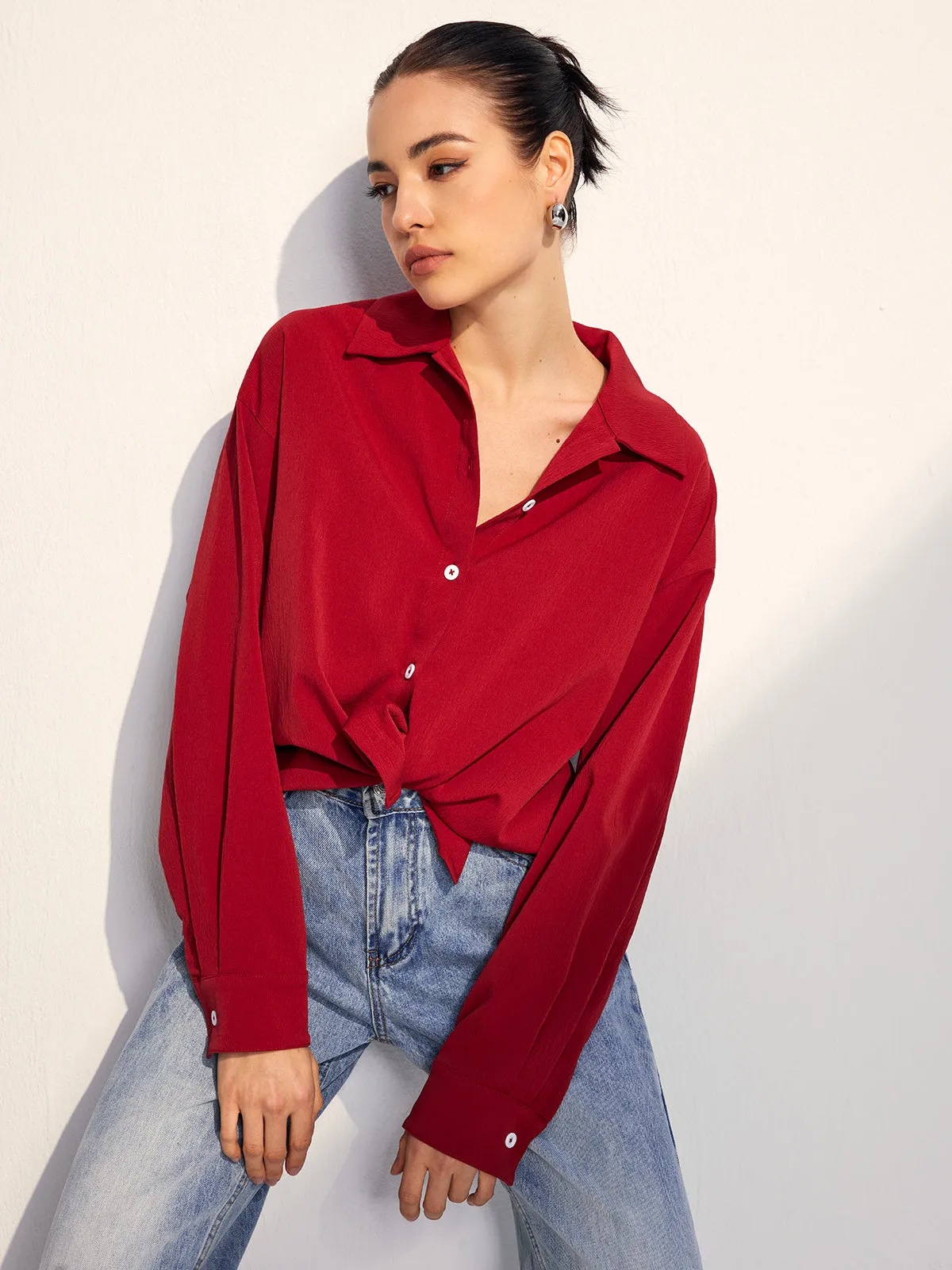 Solid Lapel Button Draped Shirt sold by COMMENSE