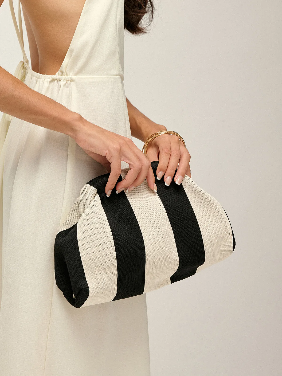 Two Tone Striped Clutch Bag sold by COMMENSE