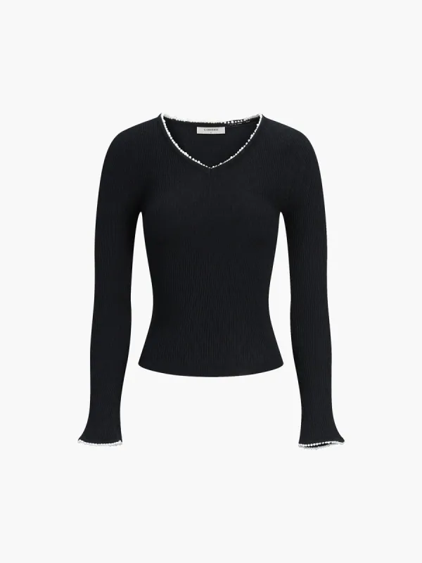 Pearl Trim Cuff and V-Neckline Knit Top sold by COMMENSE
