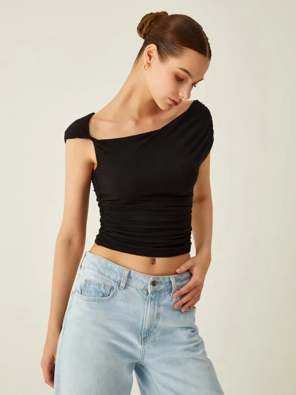 Solid Asymmetrical Top sold by COMMENSE