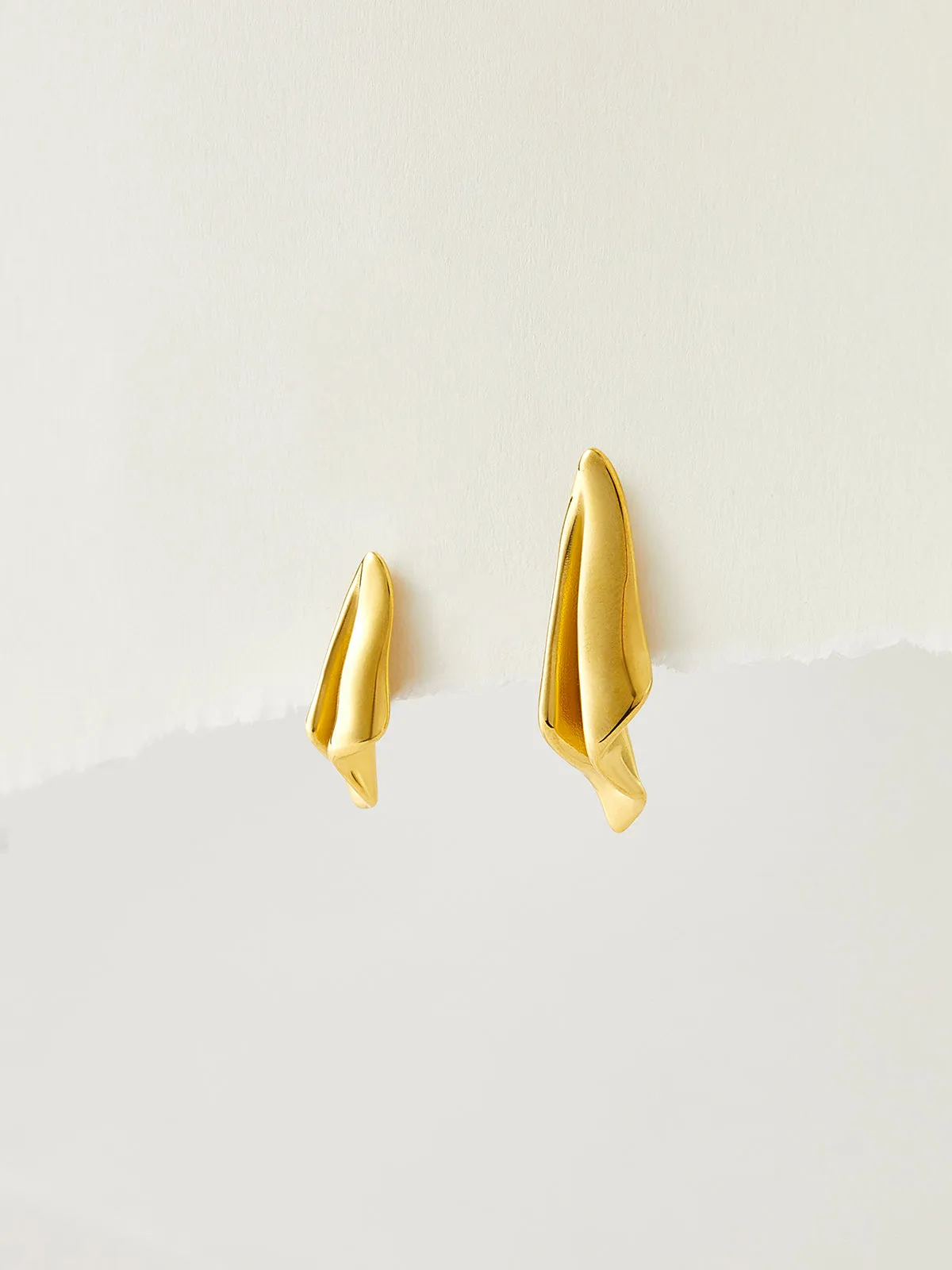 Asymmetric Paper Airplane Pleated Earrings sold by COMMENSE