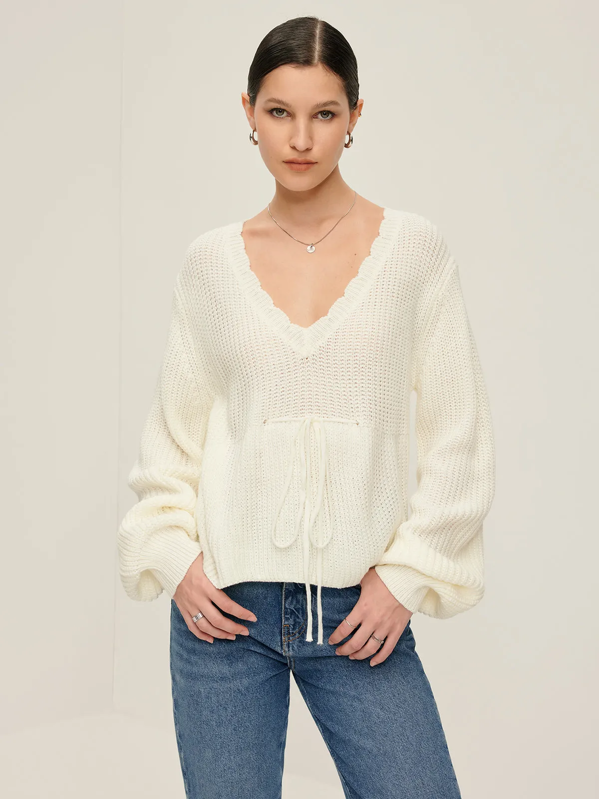 V-Neck Lettuce Trim Lace Up Sweater sold by COMMENSE