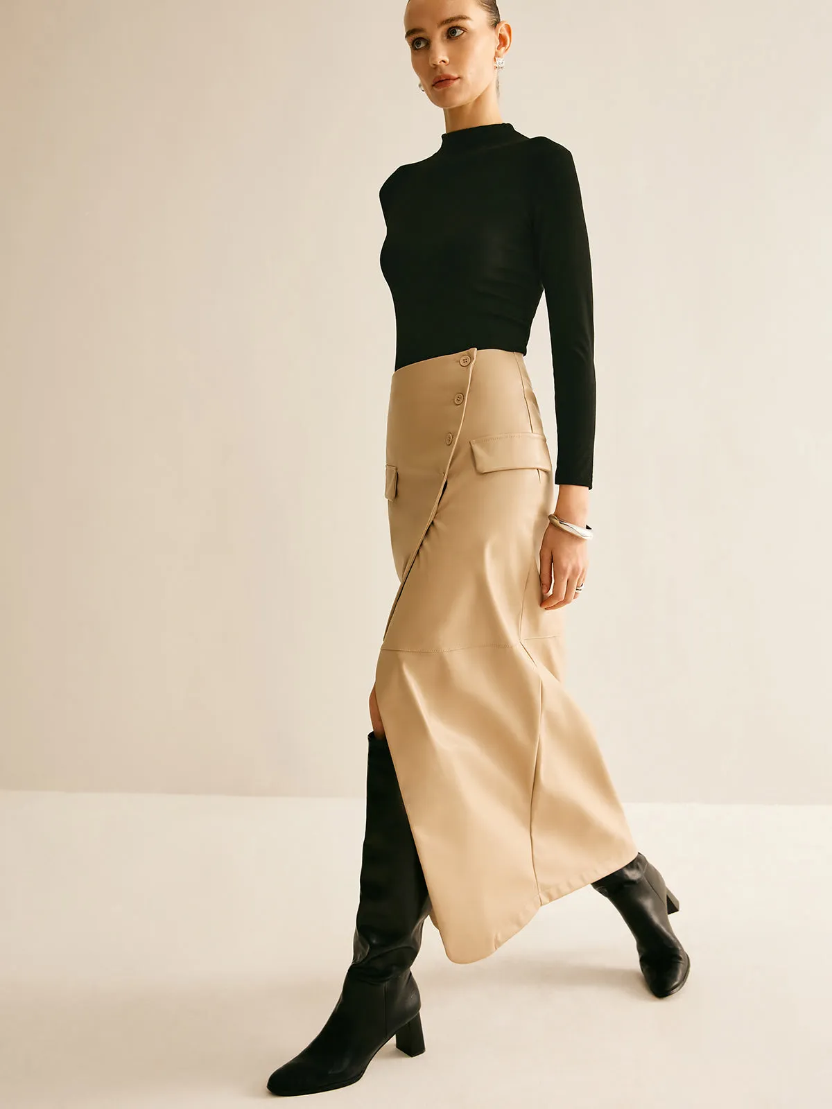 Asymmetrical Button Faux Leather Skirt sold by COMMENSE