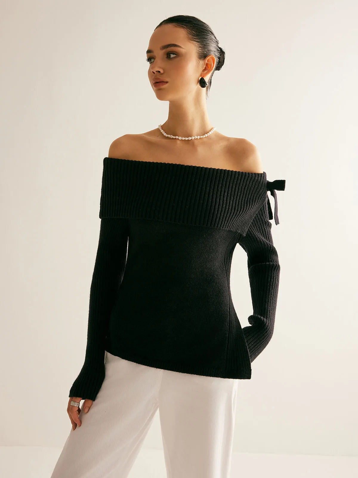 Off-Shoulder Ribbed Bow Slit Sweater sold by COMMENSE
