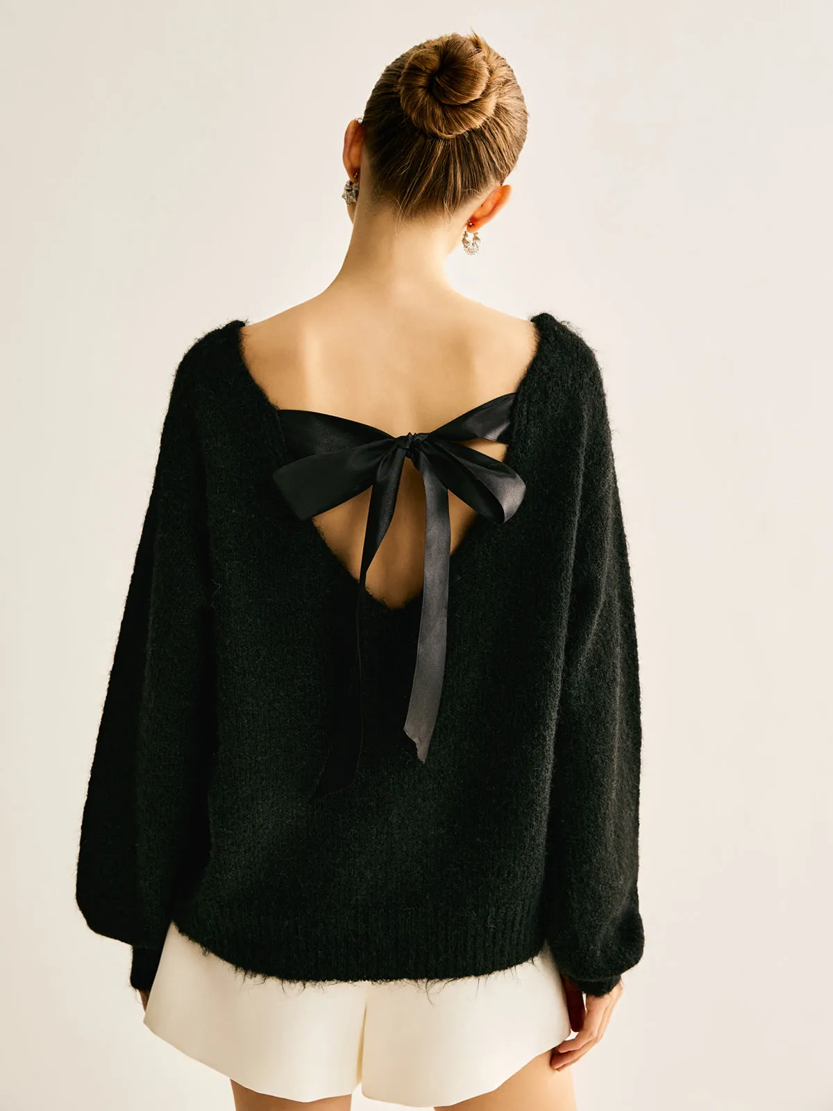 Ribbed Bow Loose Sweater sold by COMMENSE