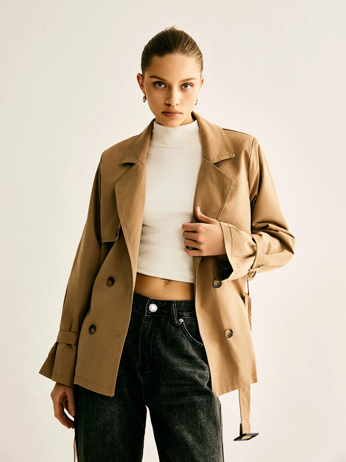Lapel Buckle-Belted Trench Coat sold by COMMENSE