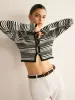 Contrast-Binding Button Cutout Crop Cardigan sold by COMMENSE
