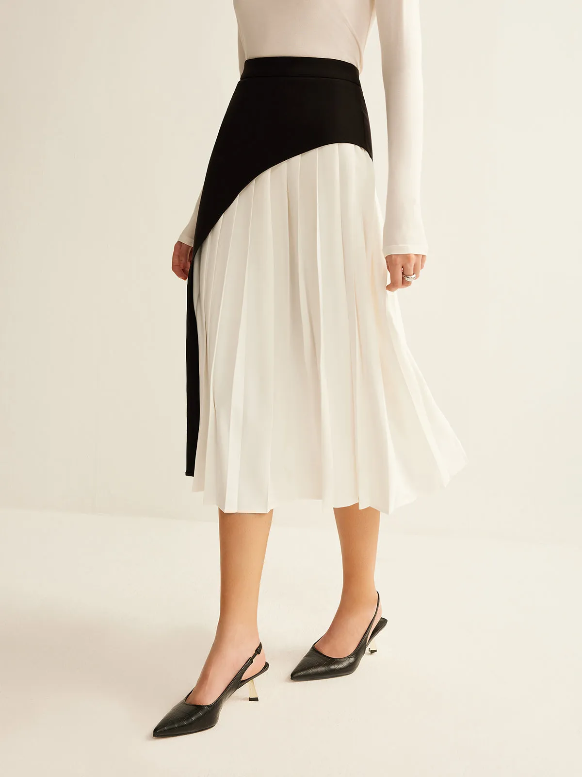 Two-Tone Pleated Midi Skirt sold by COMMENSE