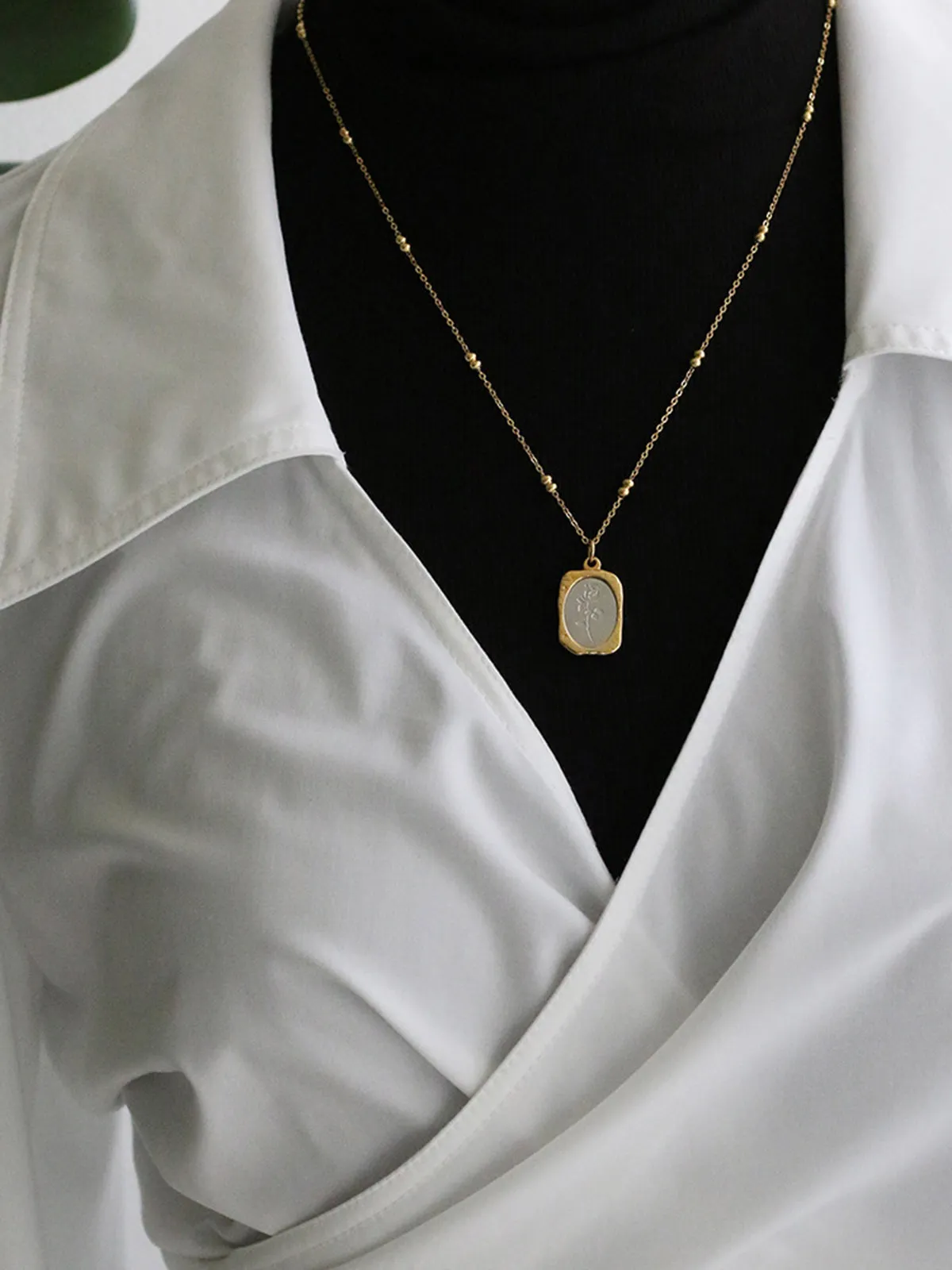 Embossed Rose Square Pendant Necklace sold by COMMENSE