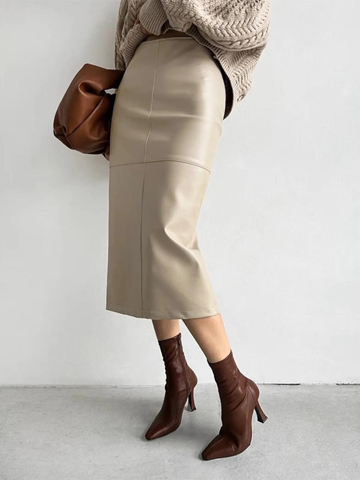 Faux Leather Piping Sit Midi Skirt sold by COMMENSE