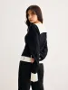 Color Block V-Neck Twist Sweater sold by COMMENSE