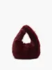 Rounded Fuzzy Handbag sold by COMMENSE