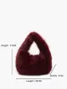 Rounded Fuzzy Handbag sold by COMMENSE