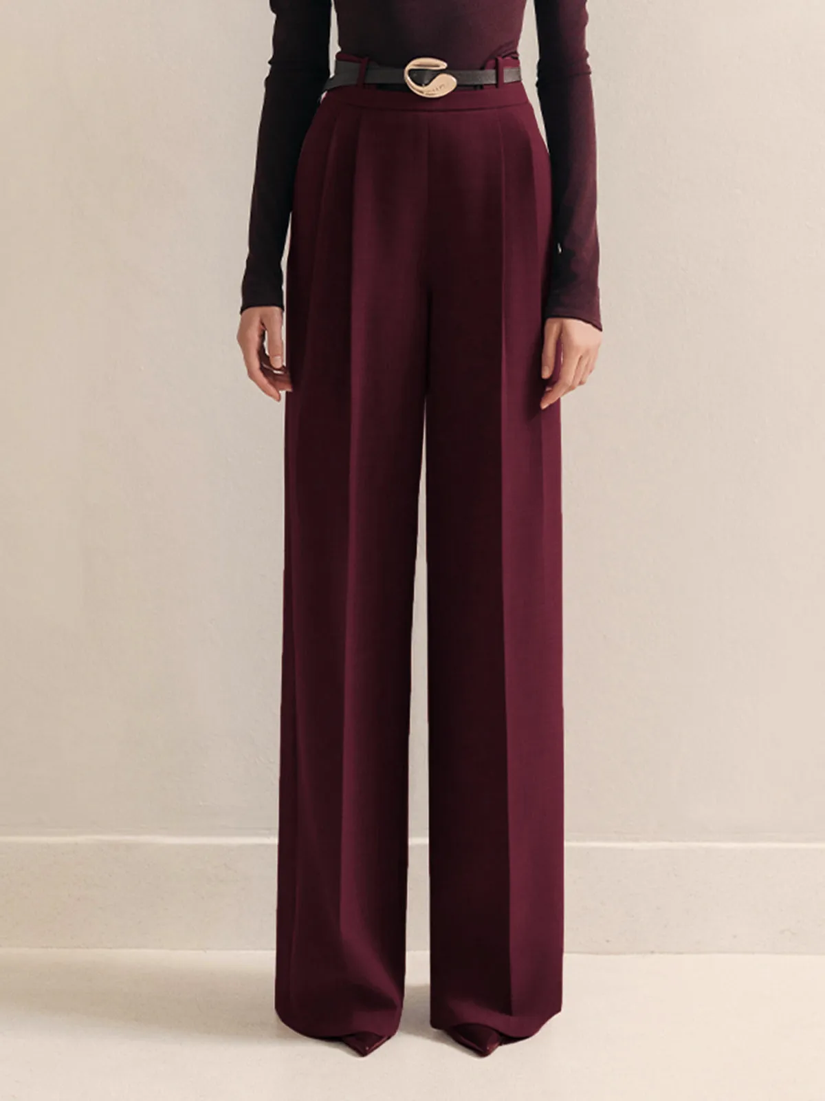 Metal-Belt Pleated High-Waist Pants sold by COMMENSE