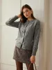 Button Down Bow-Decor Cardigan sold by COMMENSE