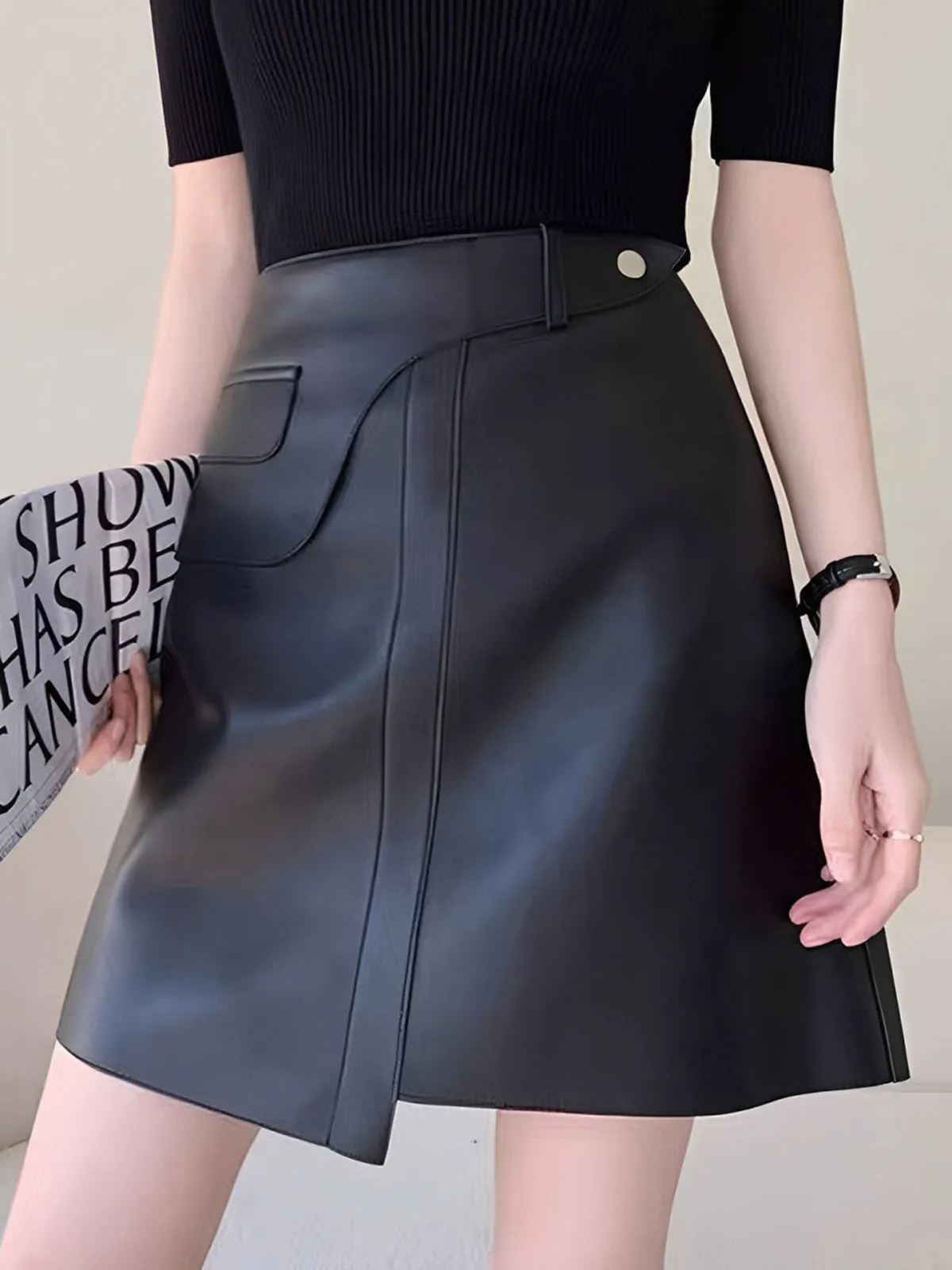 Mid-Waist Asymmetrical Faux Leather Mini Skirt sold by COMMENSE
