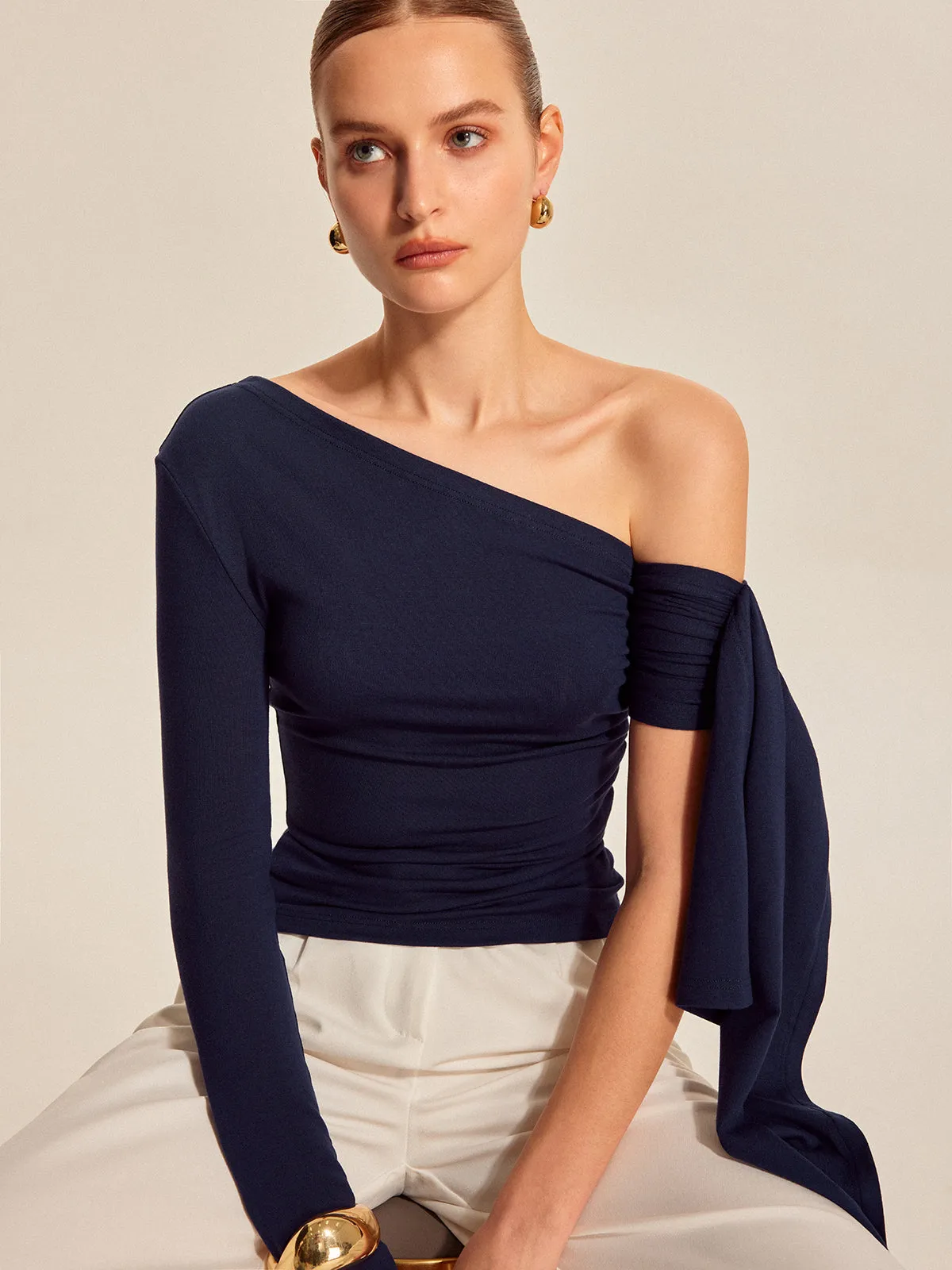 Asymmetrical Draped Sleeve Top sold by COMMENSE