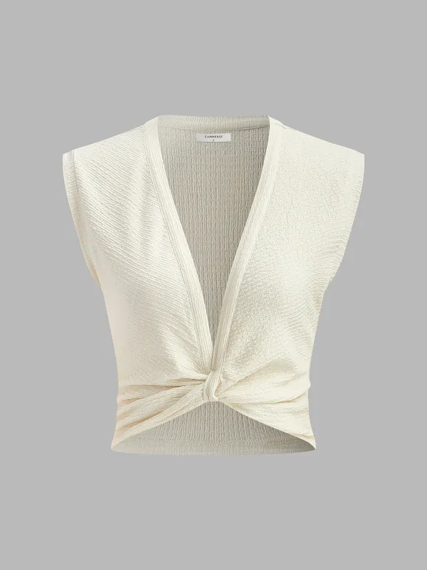 V-Neck Knot Front Sleeveless Top sold by COMMENSE