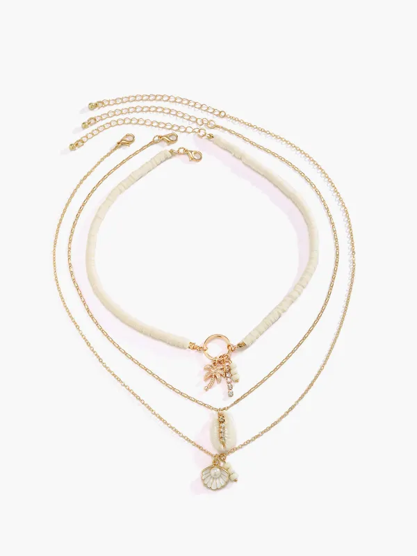 Triple Strand Shell Necklace sold by COMMENSE