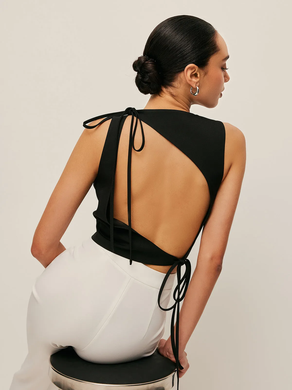 Asymmetrical Open-Back Tie Top sold by COMMENSE