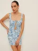 Printed Tie Front Crop Top With Skirt Set sold by COMMENSE