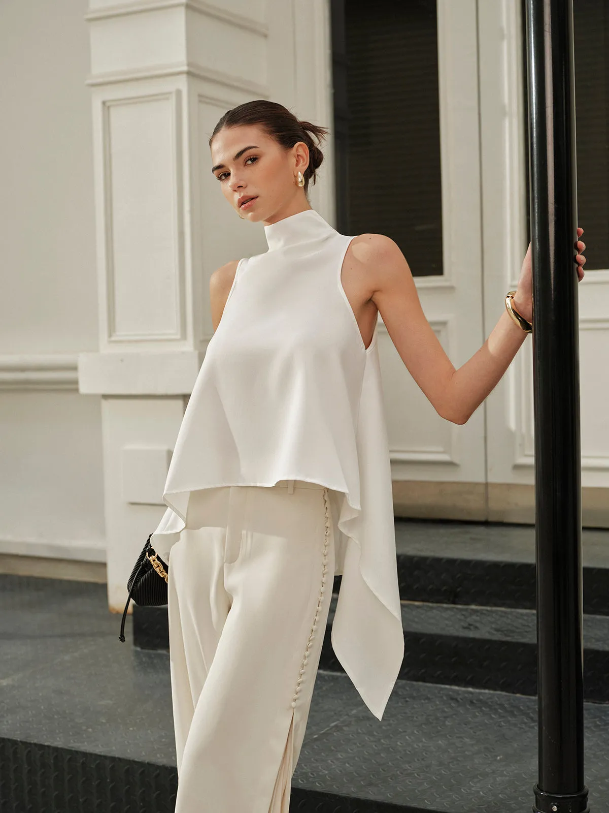 Asymmetrical Mock Neck Sleeveless Top sold by COMMENSE