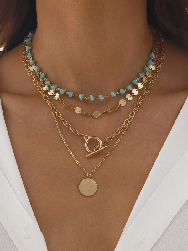 Layered Gold-Chain Necklace With Turquoise Beads And Circular Pendant sold by COMMENSE