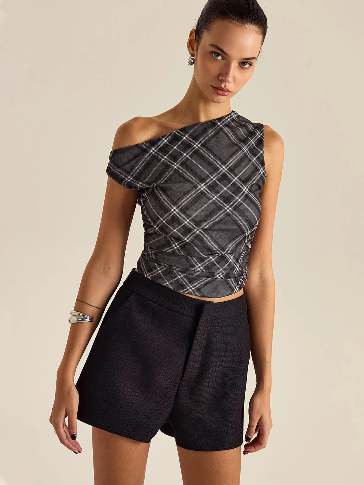 Asymmetrical Plaid Top sold by COMMENSE