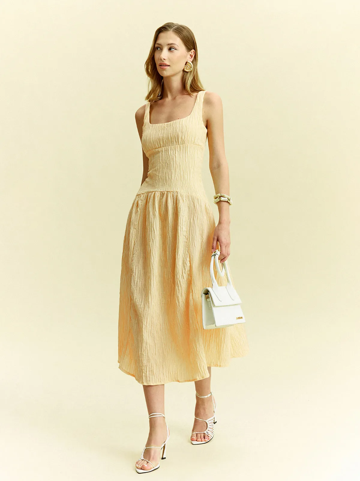 Textured Sleeveless Midi Dress sold by COMMENSE